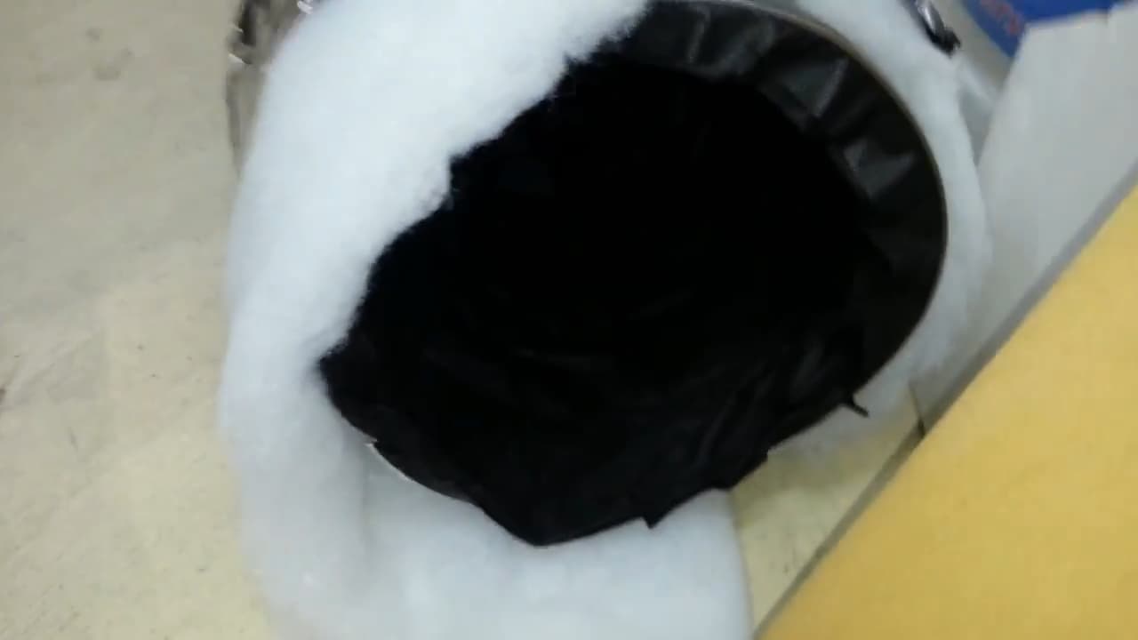 Closeup of acoustic ducting showing insulating wool